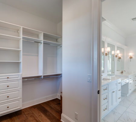 owner's closet with custom organization system and storage