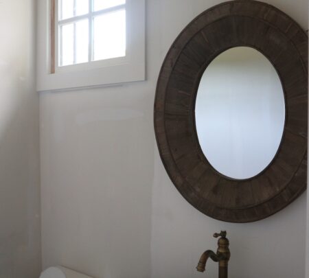 secondary bath mirror, basin sink, and toilet