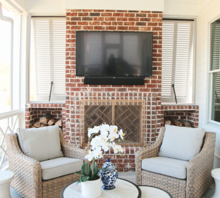 patio with fireplace, media, and seating